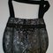 Black_and_silver_pleated_flat_view_grid