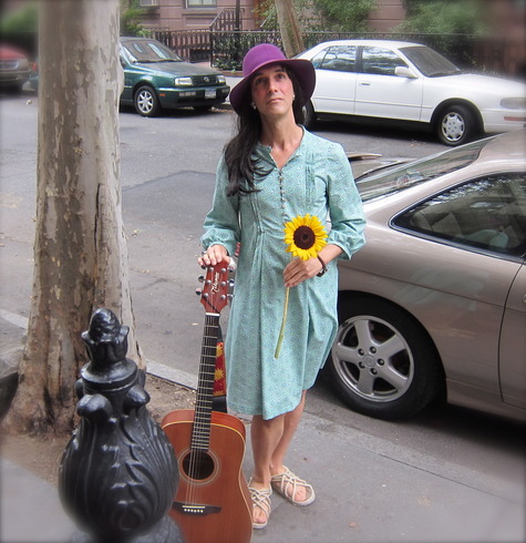 Cathy_with_flower_and_guitar_large