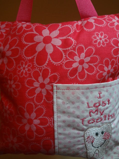 Pink_flower_and_tooth_pillow_large