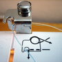 Twin_needle_thread_guide_thumb
